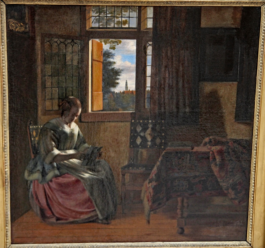 A Woman Reading a Letter by a Window